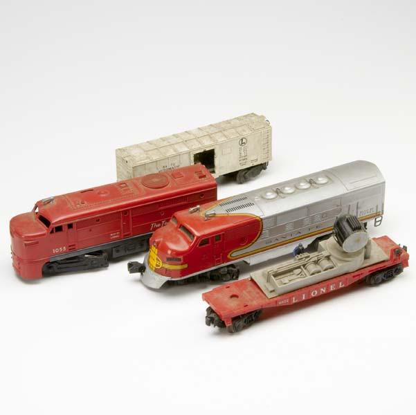 Appraisal: LIONEL TRAIN CARS Including an automatic refrigerated milk car Santa