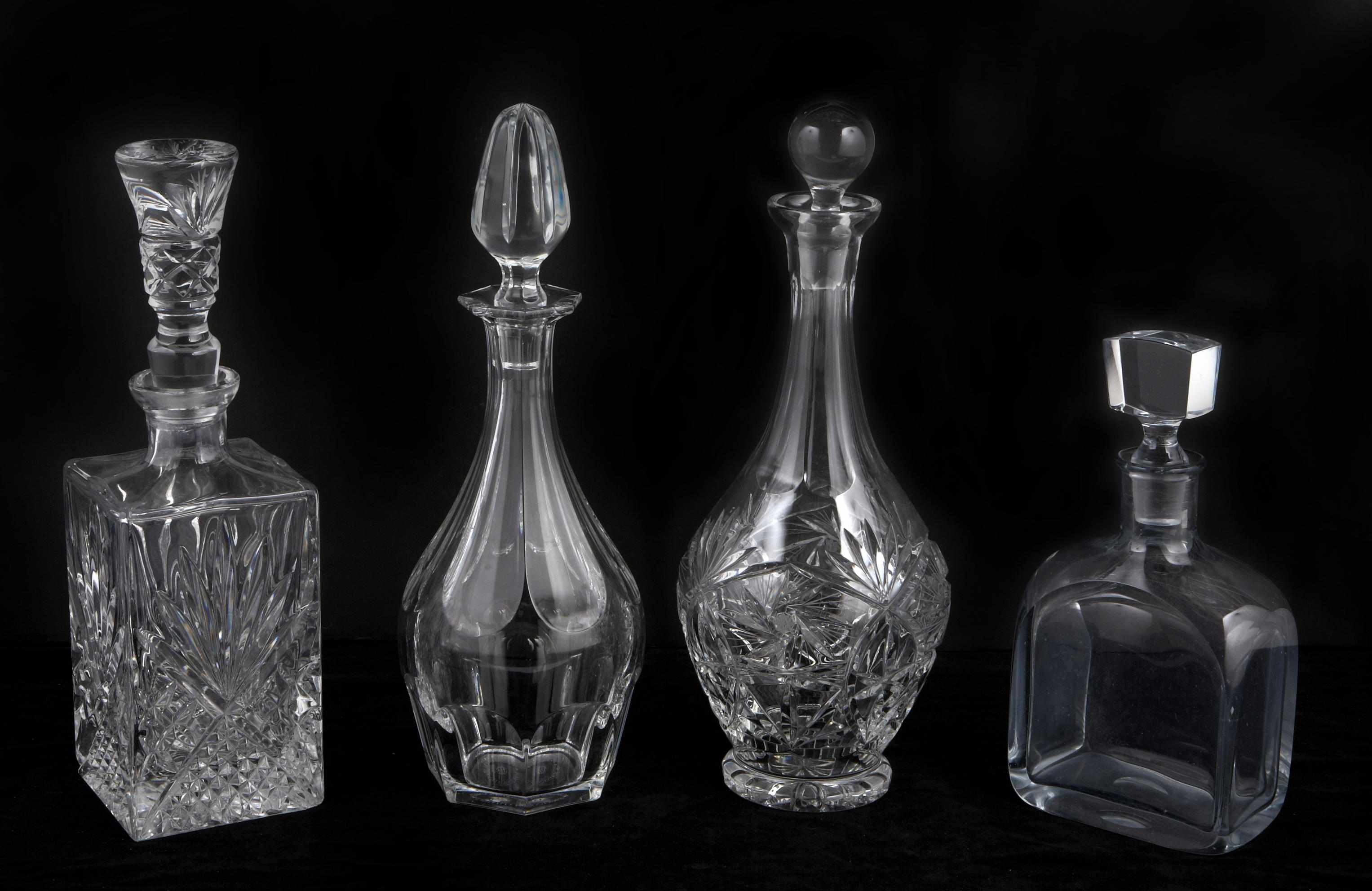 Appraisal: An assembled group of glass decanters and vases Comprising two