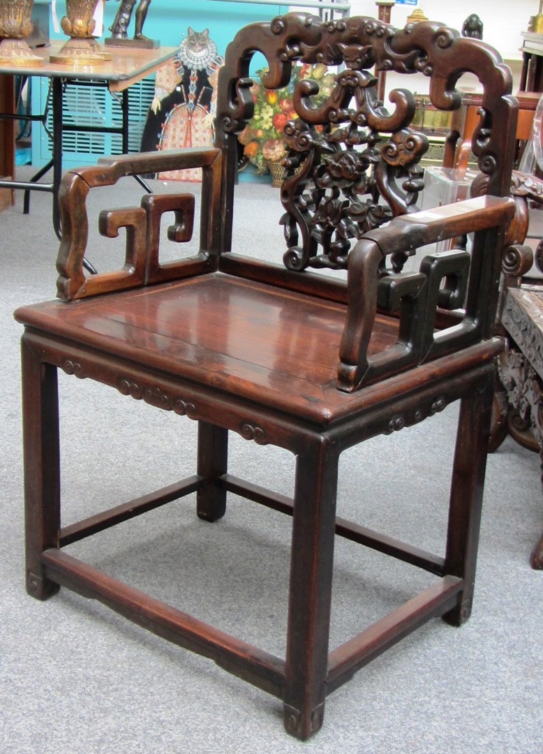 Appraisal: An early th century Chinese hardwood open armchair on block