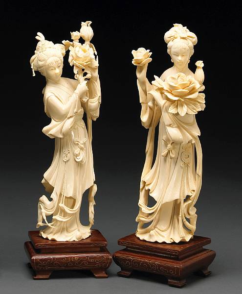 Appraisal: A pair of carved ivory beauties th Century Each beauty