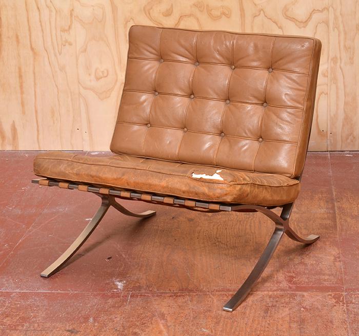 Appraisal: TAN LEATHER BARCELONA CHAIR in the style of LUDWIG MIES