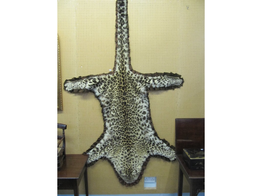 Appraisal: Leopard skin rug wall hanging