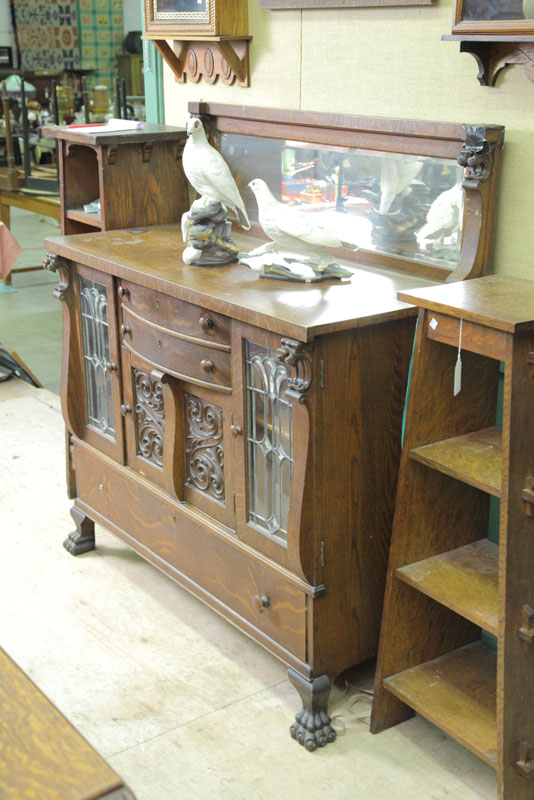 Appraisal: SIDEBOARD Oak having a mirrored gallery leaded glass doors two