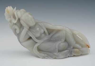 Appraisal: A Chinese Carved Grey Hardstone of a Reclining Diety Hand