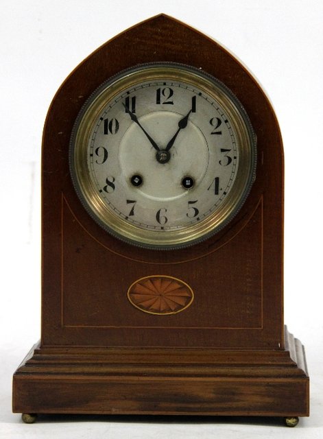 Appraisal: An Edwardian mahogany arch top mantel clock inlaid an oval