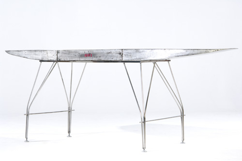 Appraisal: JONATHAN SINGLETON Unique steel and chrome Wing table the single-drawer