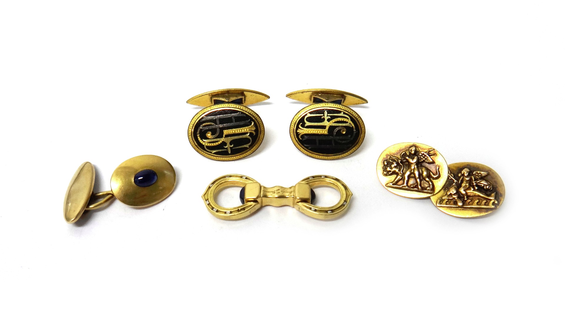 Appraisal: A Cartier Paris gold and sapphire set cufflink the sprung