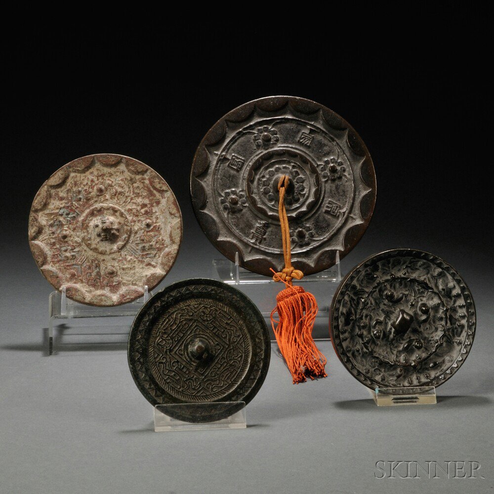 Appraisal: Four Archaic-style Mirrors China circular one cast with squirrels-and-grapes motif