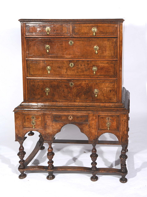 Appraisal: AN TH CENTURY WALNUT CHEST ON STAND CONSTRUCTED IN TWO