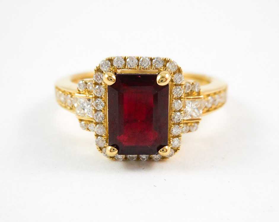 Appraisal: RUBY DIAMOND AND FOURTEEN KARAT GOLD RING with round-cut diamonds