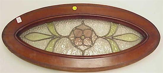 Appraisal: Ovoid stained glass panel wide wooden frame wired to hang