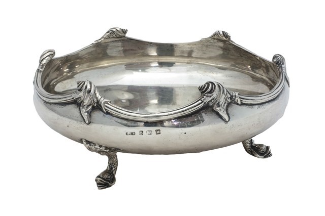 Appraisal: A silver shaped circular bowl decorated with scrolled motifs to