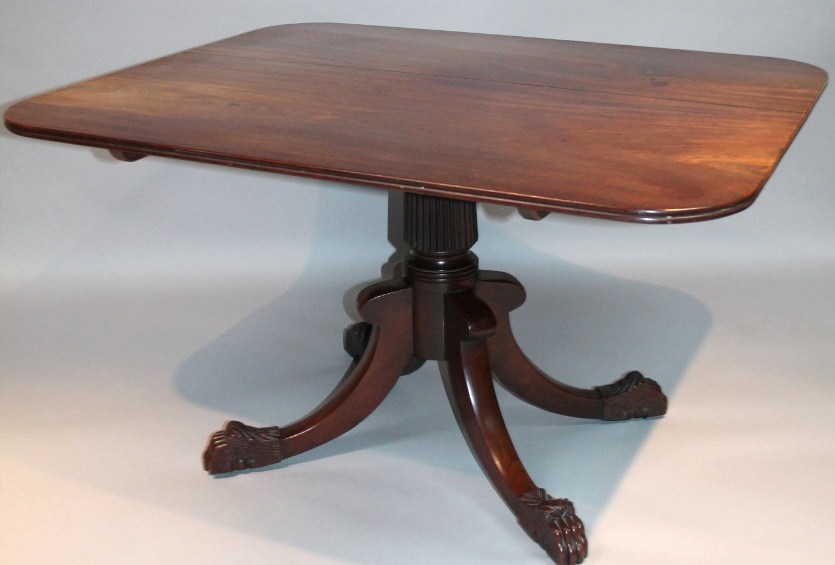 Appraisal: An early thC mahogany supper table the rounded top of