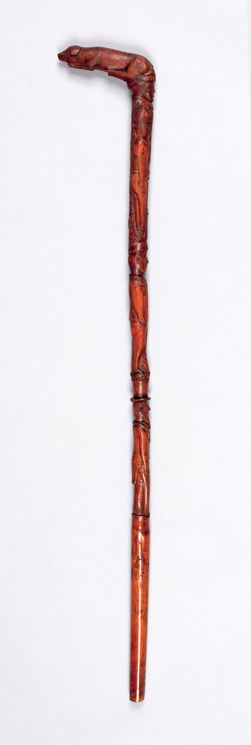 Appraisal: Carved cane with recumbent dog grip and horse rifle Uncle