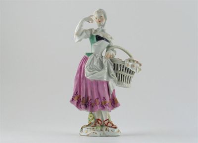 Appraisal: A Meissen model of a pastry seller holding a basket