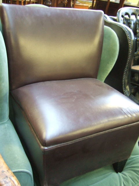 Appraisal: A pair of brown leather small bedroom chairs