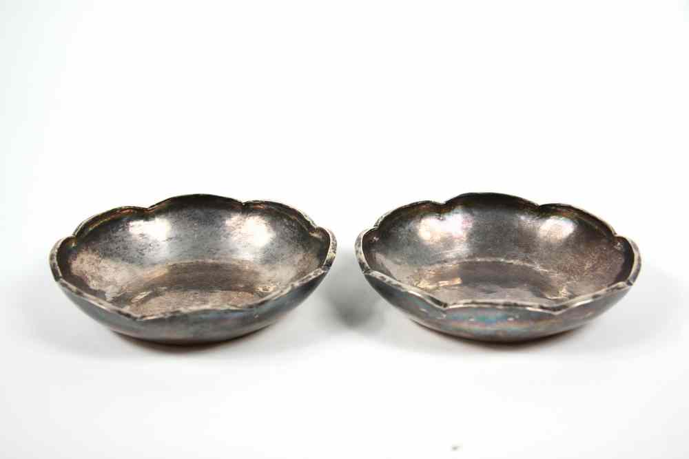 Appraisal: PERUVIAN SILVER BOWLS - s Hand Hammered Scalloped Top heavy-walled