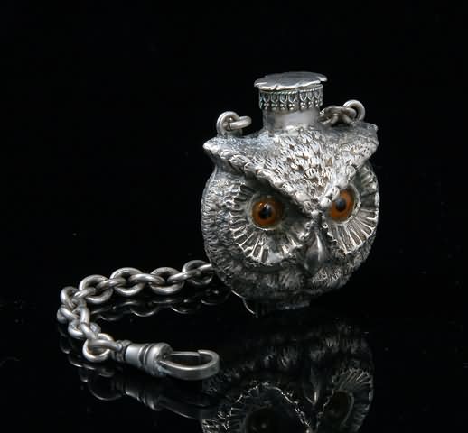 Appraisal: Modeled as an owl head with glass eyes on fob