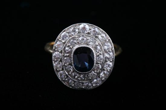 Appraisal: PLATINUM-ON- K YELLOW GOLD DIAMOND AND SAPPHIRE OVAL RING late