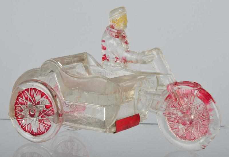 Appraisal: Glass Man on Motorcycle Candy Container Description s Made by