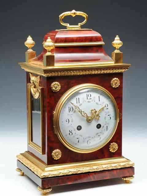 Appraisal: A TORTOISESHELL AND GILT BRASS MOUNTED MANTEL CLOCK the convex