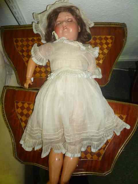 Appraisal: A GERMAN PORCELAIN HEADED DOLL marked HW Germany probably Heinrich