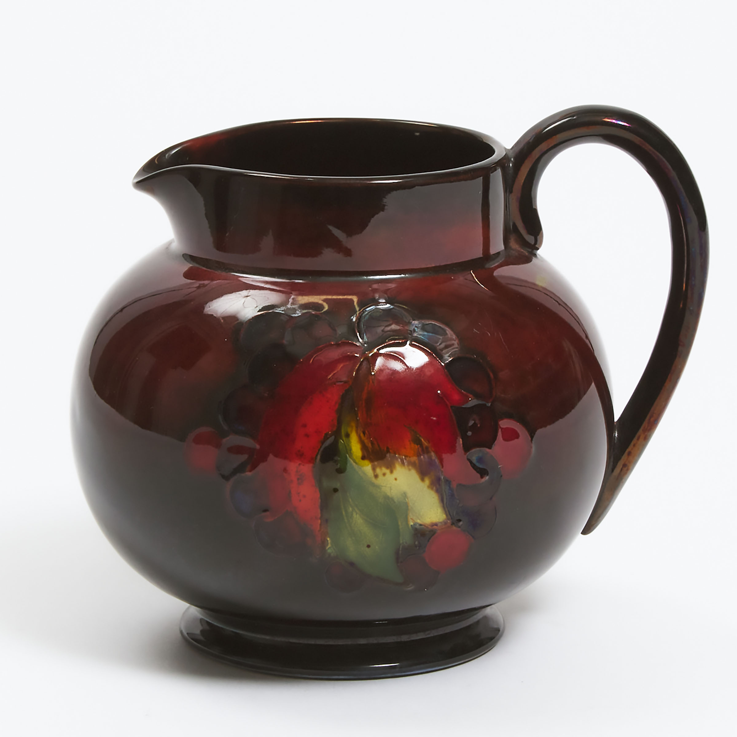 Appraisal: Moorcroft Flamb Grape and Leaf Jug s height in cm