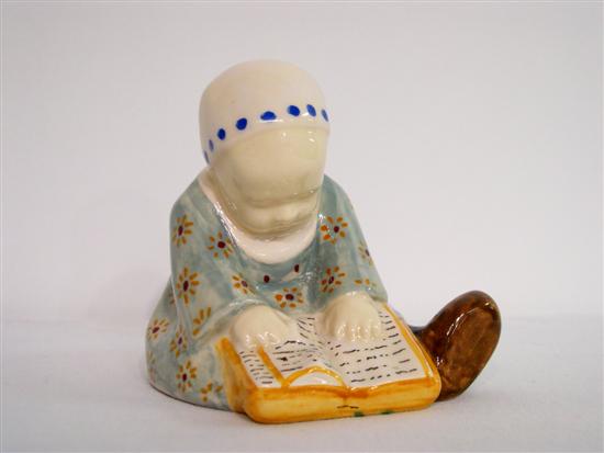 Appraisal: A B Quimper figure of a young girl reading signed