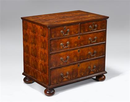 Appraisal: English oyster veneered walnut chest of drawers The rectangular feather