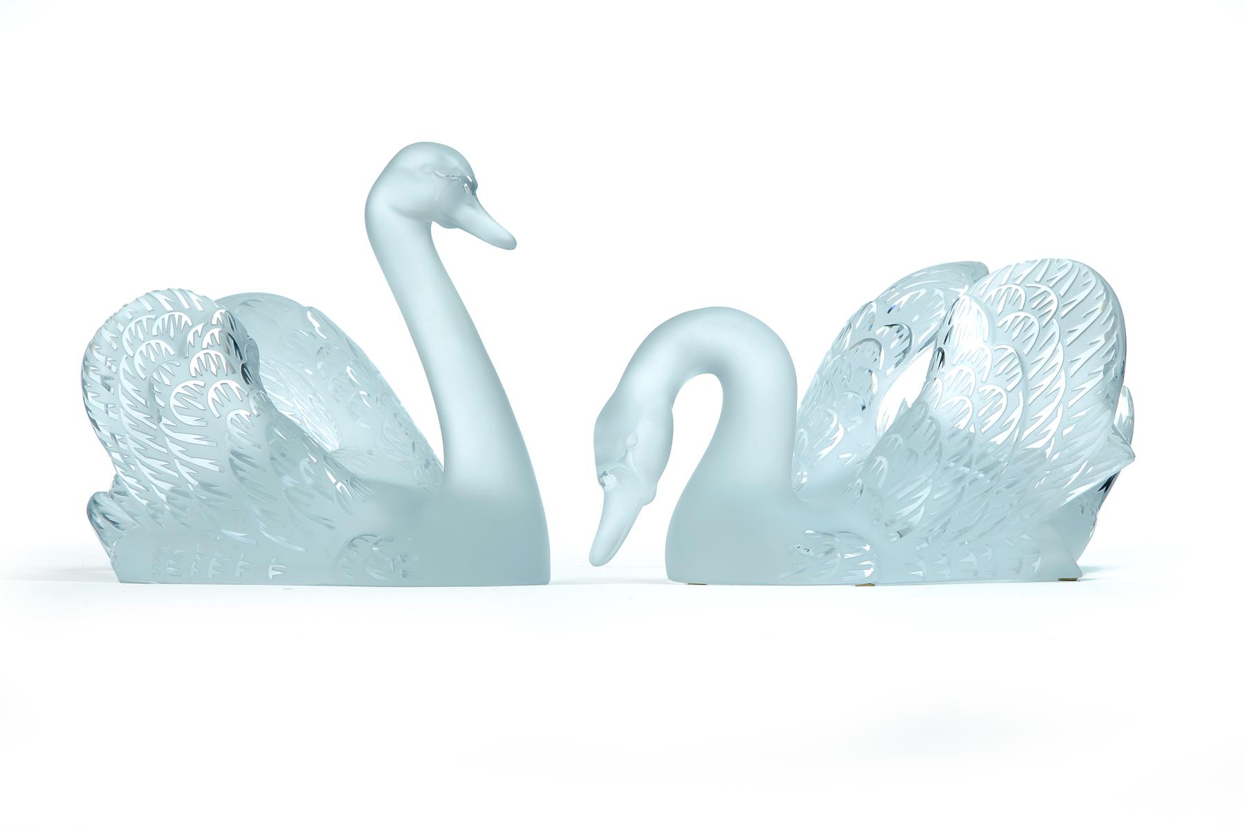 Appraisal: TWO LALIQUE SWANS France nd quarter- th century Frosted swimming