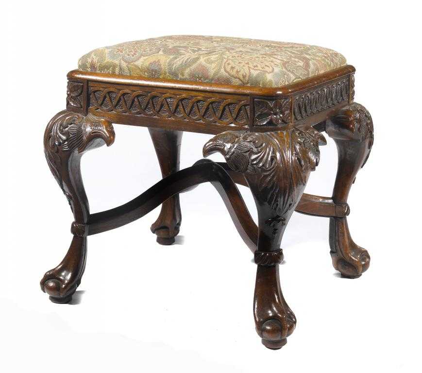 Appraisal: A VICTORIAN CARVED WALNUT STOOL the cabriole legs with eagles'