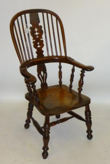 Appraisal: A YEW WINDSOR ARMCHAIR similar to the previous lot