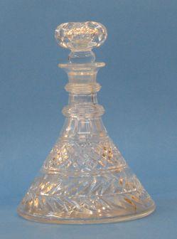 Appraisal: A REGENCY DESIGN SHIPS DECANTER with a cut stopper and