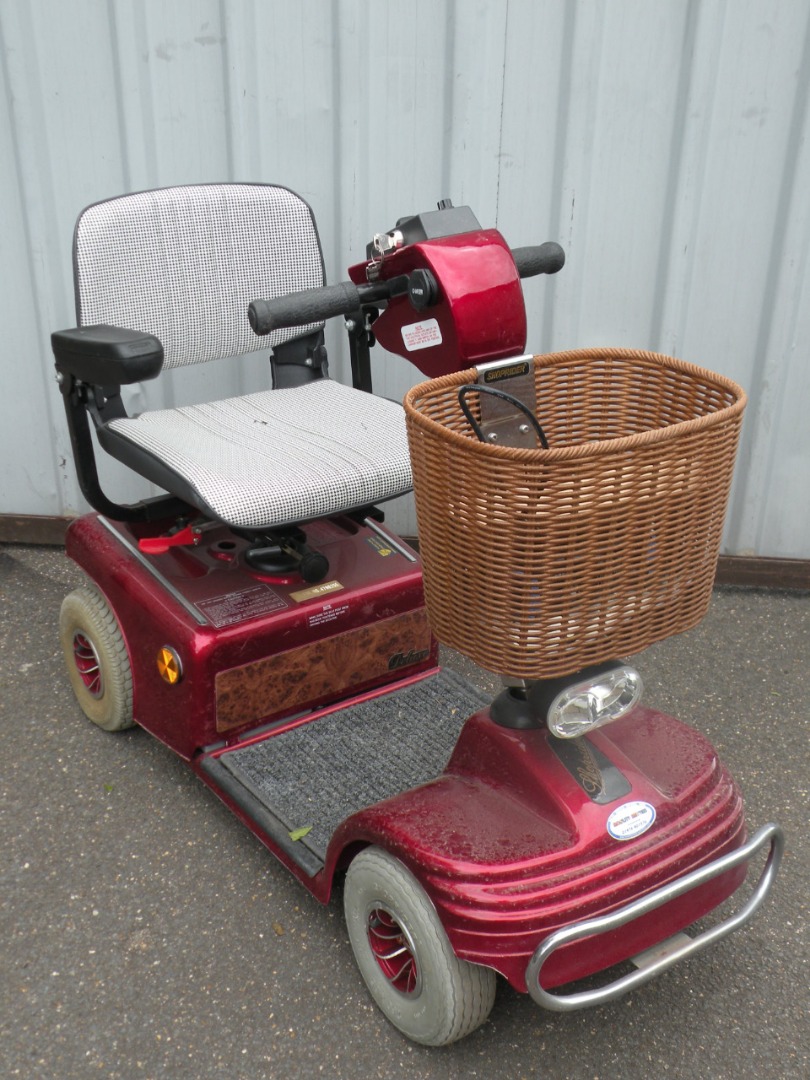 Appraisal: A Shoprider four wheeled mobility scooter with key and battery