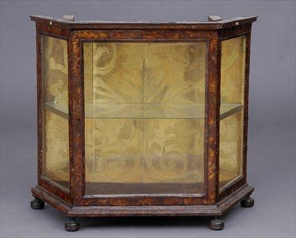 Appraisal: CONTINENTAL BAROQUE-STYLE TORTOISESHELL VENEERED TABLE CABINET With chamfered glazed sides