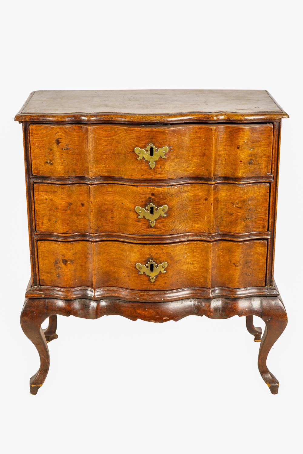 Appraisal: CONTINENTAL OAK WALNUT PETITE COMMODE th Century the molded top