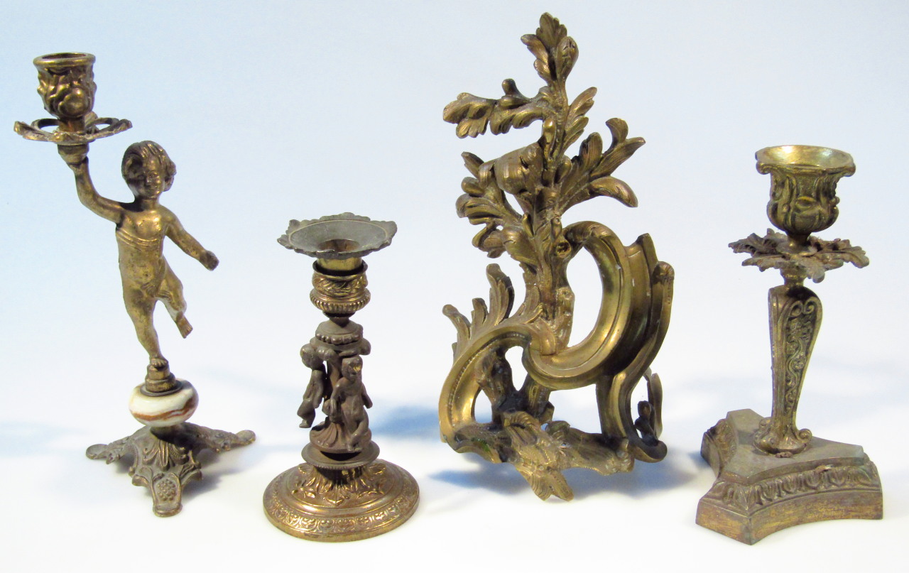 Appraisal: Various thC candlesticks comprising a cherub holding an urn dish