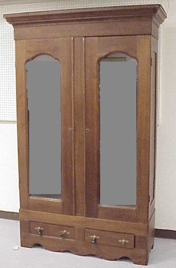 Appraisal: Walnut armoire c later conversion to display cabinet cove molded