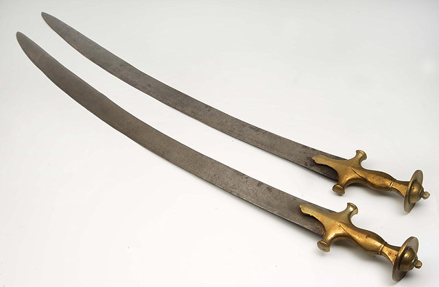 Appraisal: TWO SIMILAR MIDDLE EASTERN OR INDIAN TULWAR SWORDS with steel