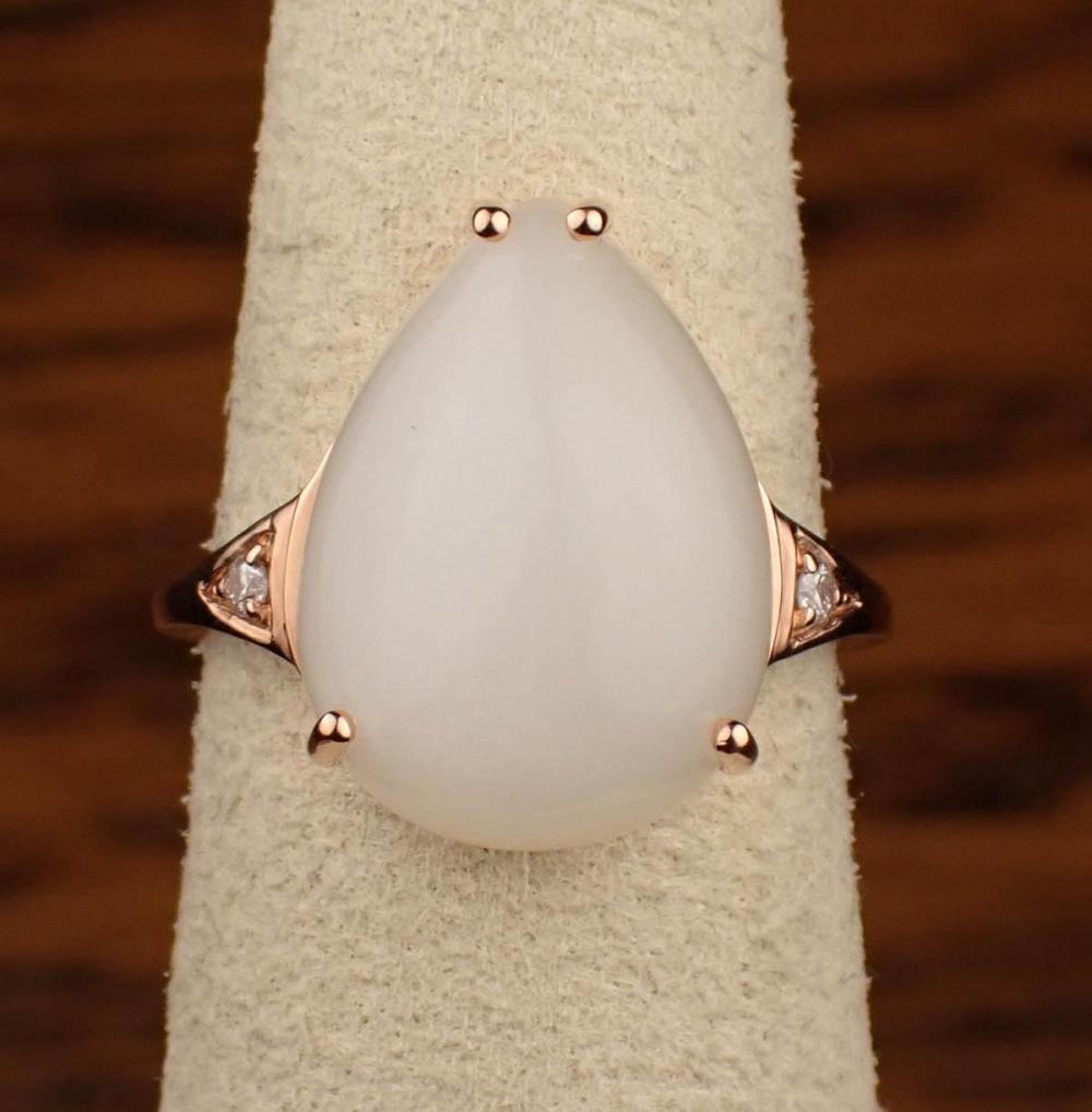 Appraisal: CAT'S EYE MOONSTONE AND DIAMOND RING The k rose gold