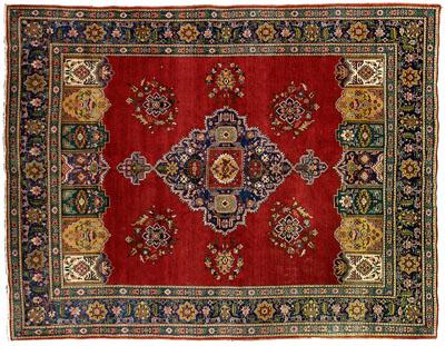 Appraisal: Hand-woven Persian rug central medallion with pendants on burgundy field