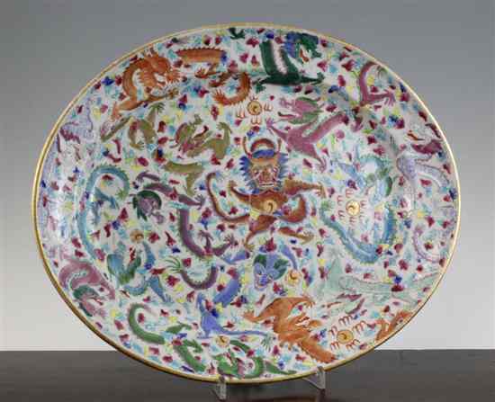 Appraisal: A Chinese famille rose oval 'dragon' dish late th early