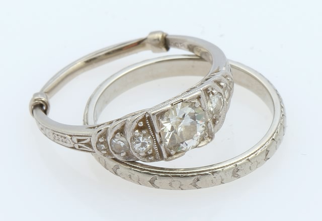 Appraisal: Platinum diamond ring with KW band mm minecut round center