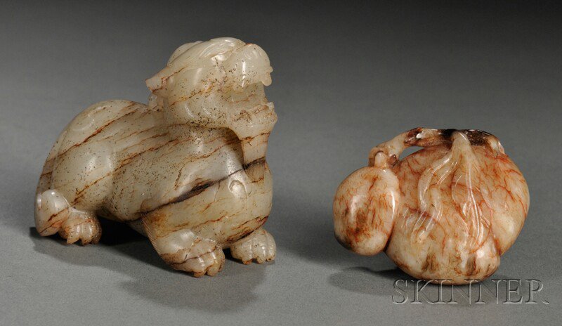 Appraisal: Two Stone Carvings China one carved as a recumbent qilin