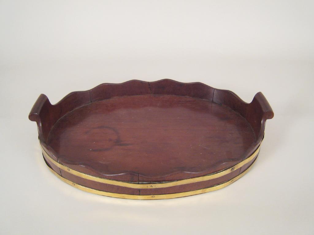 Appraisal: A th Century brass bound mahogany two handled oval Gallery