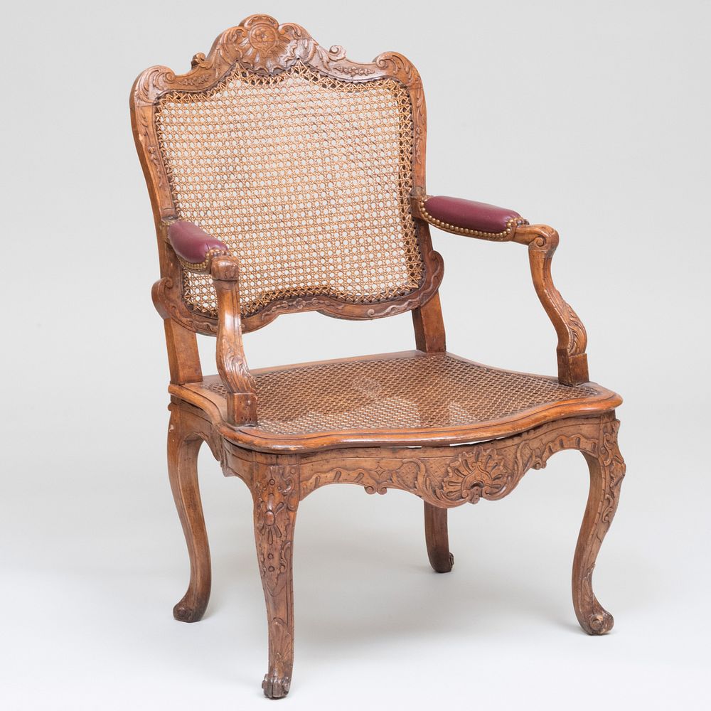 Appraisal: R gence Stained Beechwood and Caned Fauteuil en Cabriolet With