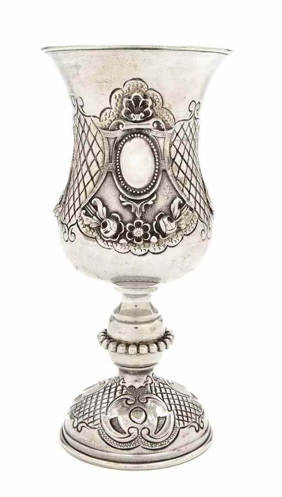 Appraisal: A Continental Silver Chalice of baluster form with repousse shell