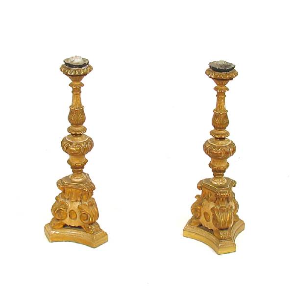 Appraisal: A pair of Baroque style parcel gilt prickets height in