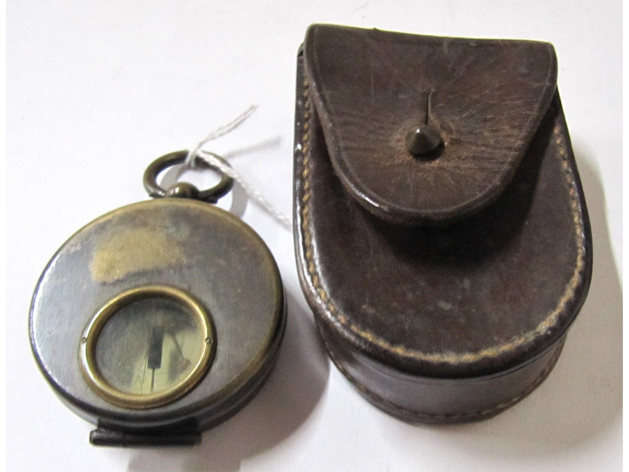 Appraisal: A pocket compass in leather case