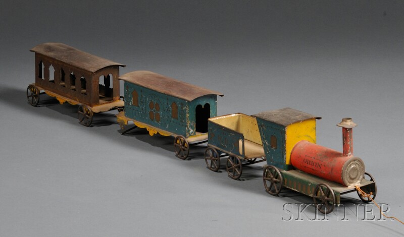 Appraisal: Polychrome-painted Tin Toy Train Set America late th century painted